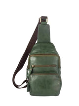 Green leather sling bag on a white background