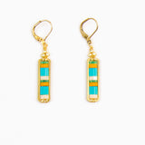 Pair of earrings with gold hooks, rectangular green and blue stones on a white background