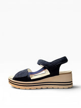 Blue sandal on a white wedge heel