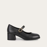 A black leather Mary Jane block heel shoe with a gold-tone buckle, shown in a side profile on a light off-white background.