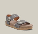 Steel grey sandal with brown sole on a beige background
