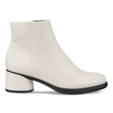 A white leather ankle boot with a chunky block heel and a contrasting black sole, shown from a side profile on a white background.