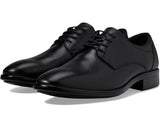 Pair of black dress shoes on a white background