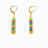 Gold earrings with colorful rectangular stones on a white background
