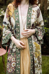 Woman wearing a floral kimono-style outfit with a natural background