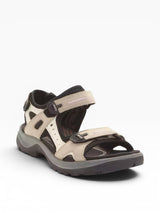 Beige and black sandal on a white background