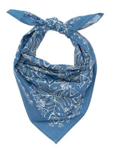 Blue bandana with white floral pattern on a white background