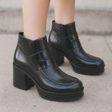 Black Eric Michael Gotham bootie for women featuring sleek leather design and stylish ankle-high silhouette.