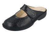 Black shoe with a strap on a white background