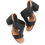 Kork Ease Brynn Slide Sandal featuring a tan leather strap and comfortable flat sole, perfect for casual summer wear.
