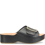 Kork Ease York sandal featuring tan leather straps, ankle buckle, and a woven cork heel for casual summer wear.