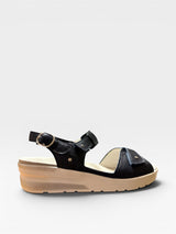 Blue sandal with a thick sole on a light gray background