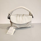 White handbag with a tag on a light gray background