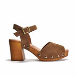 Brown suede sandal with wooden block heel on a white background