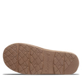 The textured brown rubber outsole of a slip-on shoe, featuring diamond tread patterns and the debossed brand name 'BEARPAW', shown against a plain white background.