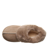 A single slip-on slippers boot in light brown suede with a thick, fluffy faux-fur trim and a decorative whipstitch detail, shown against a plain white background.