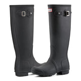 A pair of tall black rubber rain boots with buckle straps, shown on a clean white background. The brand logo for Hunter is visible on the side of the collar of the right boot.