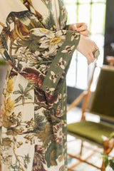 Close-up of a floral-patterned garment with a blurred indoor background