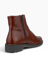 Single brown ankle high waterproof boot