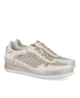 Beige sneaker with perforated design on a white background
