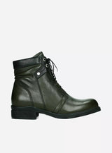 Wolky Center 2628 water-resistant lace-up boot in a forest setting, showcasing durable outdoor footwear for rugged terrains.