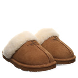 A pair of brown suede slipper mules with thick cream shearling lining, shown on a plain white background.