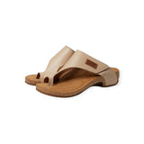 Pair of beige sandals with cork sole on a white background