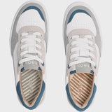 Pair of gray and white sneakers with blue accents on a light gray background