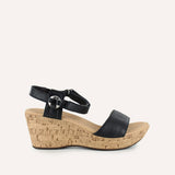Black wedge sandal with cork sole on a white background