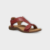 Red Taos The Show sandal with adjustable straps and cushioned footbed, designed for comfort and casual style.