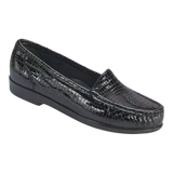 Black crocodile-patterned loafer shoe on a white background