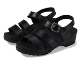 Black sandals with multiple straps on a white background