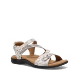 White sandal with black speckles on a white background