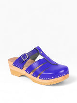 Strada navy blue leather Mary Jane open-back clogs with adjustable strap and silver stud detail on wooden sole.