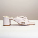 Strada white leather knotted slide sandals with a 2.5" block heel. Made in Italy.