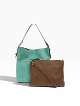 Turquoise and brown handbags on a white background