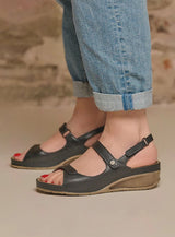 Close-up of Wolky Pica 00410 sandal showing beige leather straps and cushioned footbed, highlighting comfortable, stylish footwear.