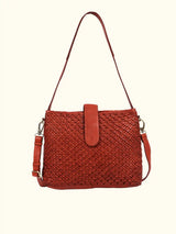 Cognac woven handbag with a white background