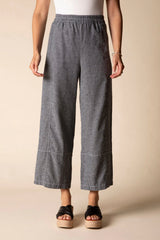Model wearing charcoal grey linen cropped pants
