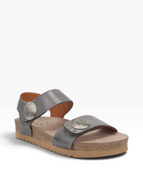 Steel grey sandal with brown sole on a beige background
