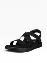 Bkacj sandal with criss-cross straps on a white background