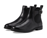 Pair of black leather boots with a buckle on a white background