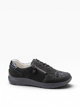 Black sneaker with decorative pattern on a white background