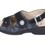 Finn Comfort Isera 5004 women's sandal featuring navy leather straps and cushioned footbed for comfort and style.
