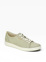Light green sneaker with white laces on a white background