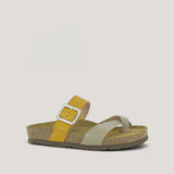 Yellow sandal with a strap and buckle on a beige background