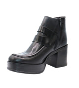 Eric Michael Gotham black leather boot with a sleek design and sturdy sole, showcasing the stylish footwear from the front angle.