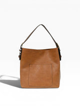 Brown leather handbag with a shoulder strap on a white background