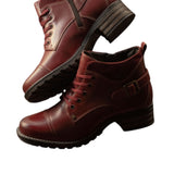 Pair of brown leather boots on a white background