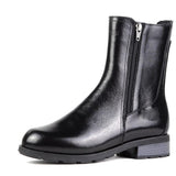 Black leather ankle boot with a zipper on a white background